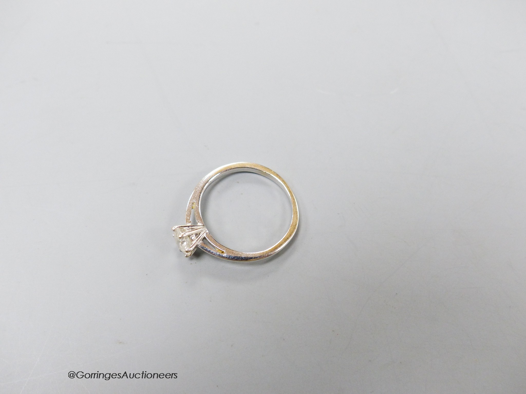 An 18ct white gold and solitaire diamond ring, size K/L, gross 2.2 grams.